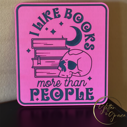 3d printed wall art saying I like books more than people with the image of a skull, books, moon crescent and stars