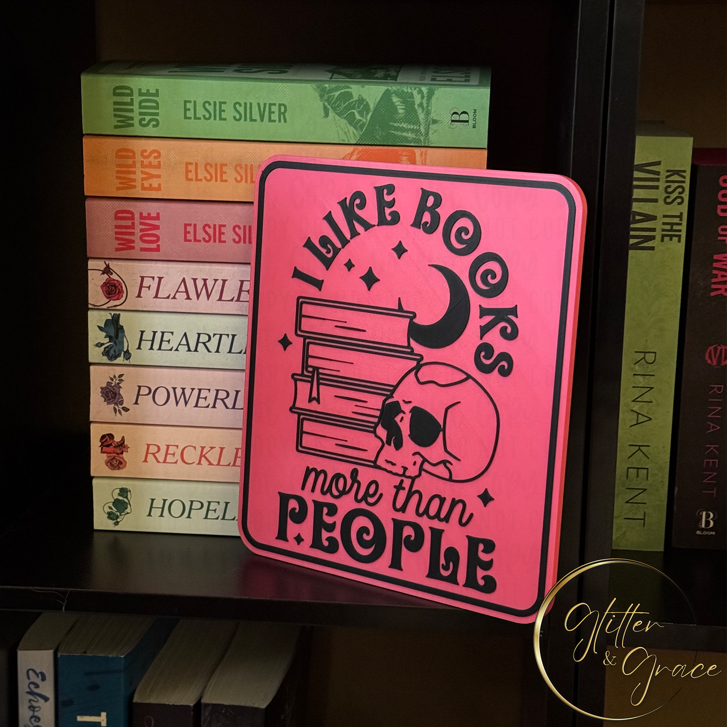 3d printed wall art saying I like books more than people with the image of a skull, books, moon crescent and stars