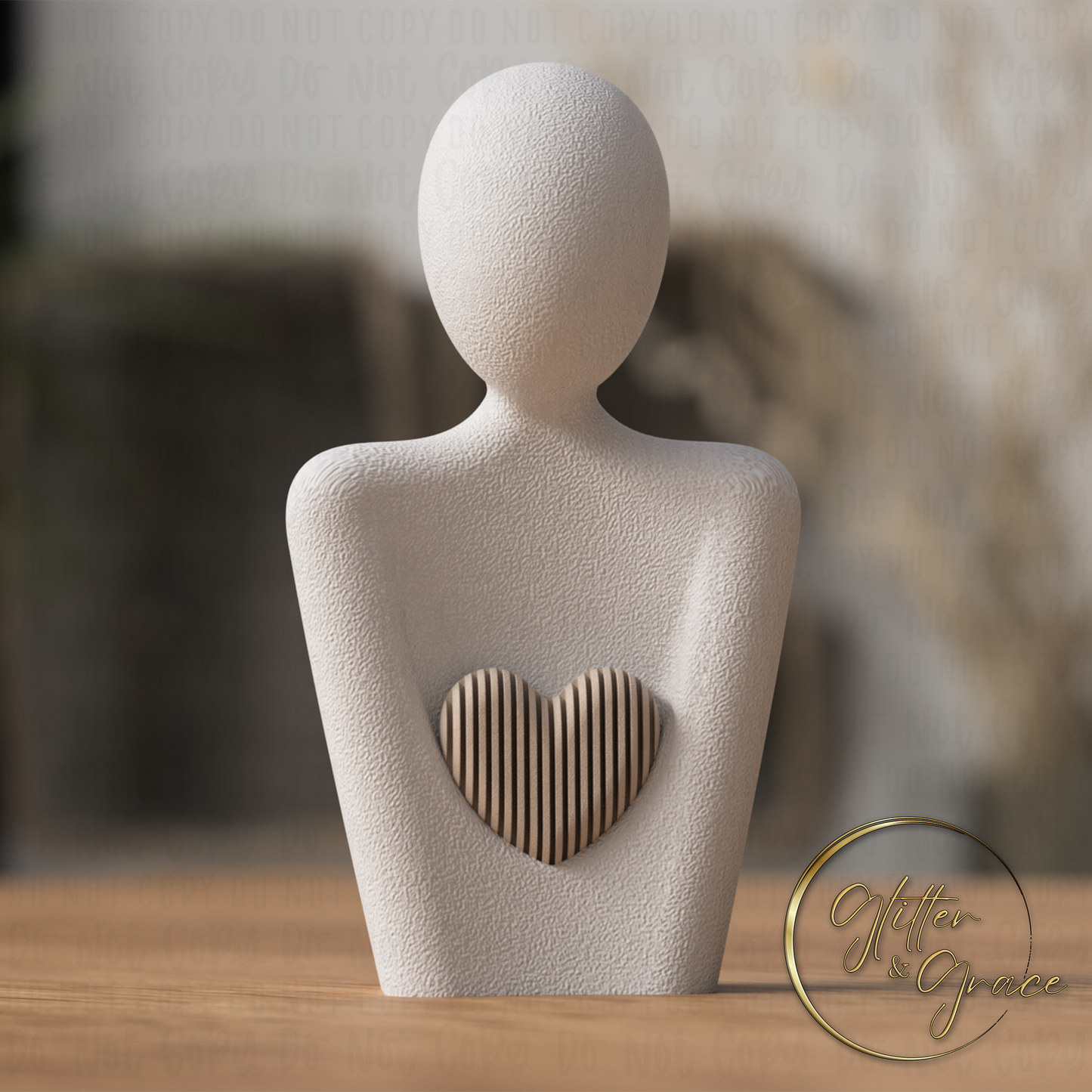 3d printed statue of a mother with a heart above the arms