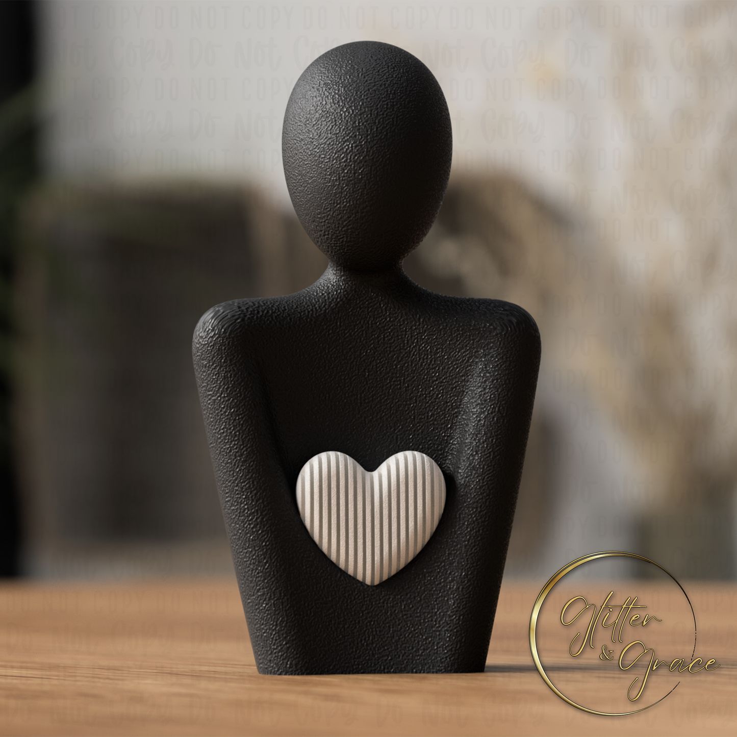 3d printed statue of a mother with a heart above the arms