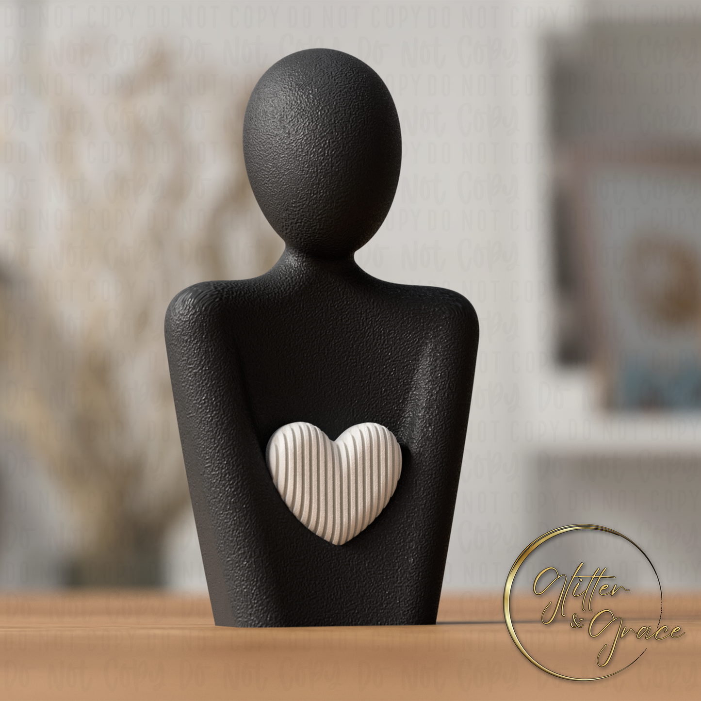 3d printed statue of a mother with a heart above the arms