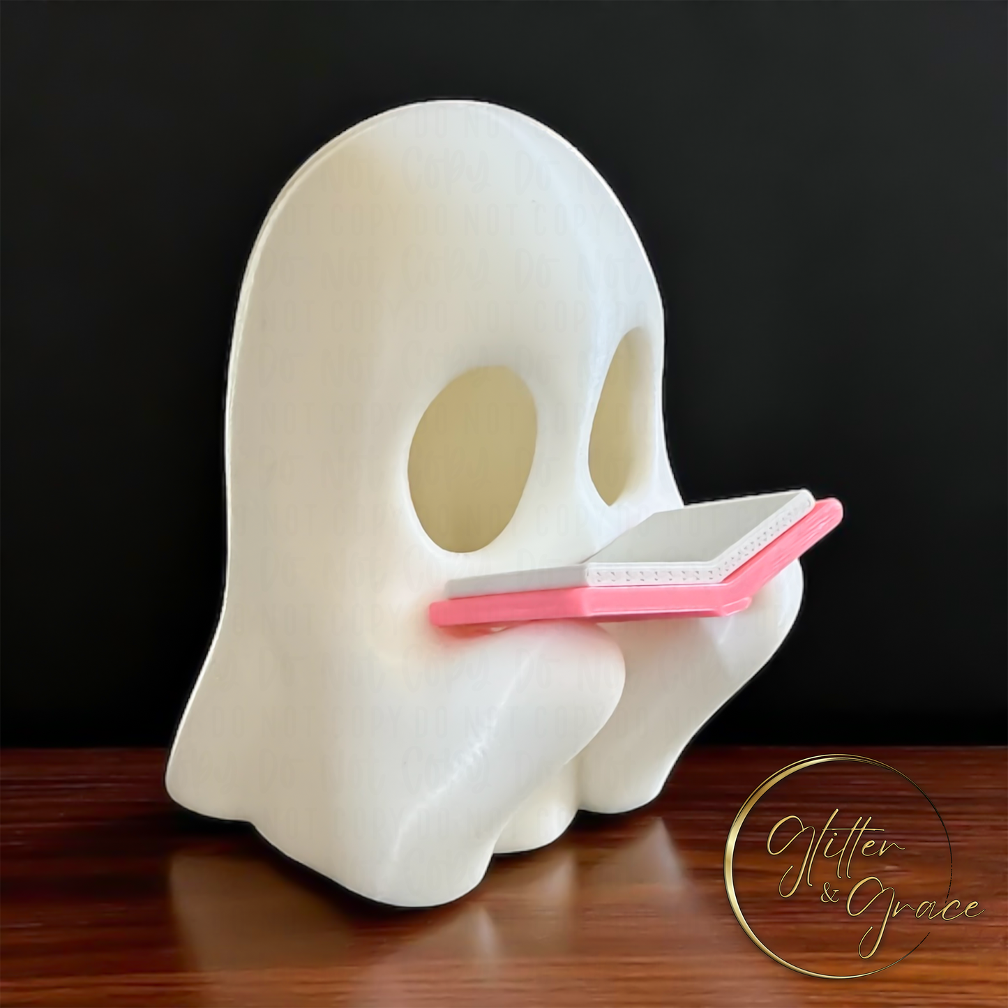 3d printed figurine of a ghost reading a book
