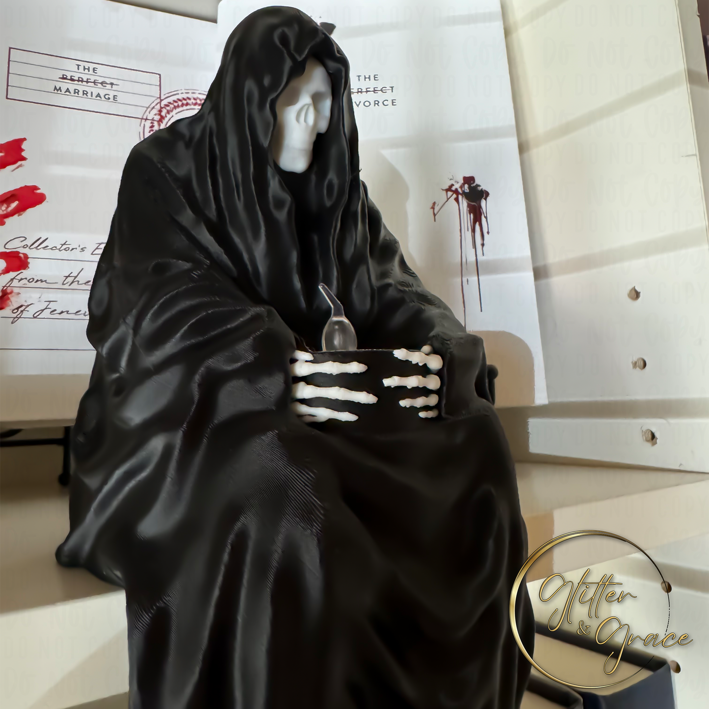 3d printed statue of a sitting grim reaper holding a led tealight candle