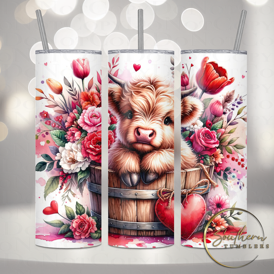 20oz skinny sublimated tumbler with an image of a baby highland cow in a bucket surrounded by flowers