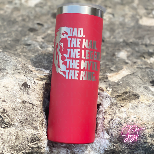 20oz skinny straight powder coated tumbler in the color red laser engraved with a lion face saying dad the man the legend the myth the king 