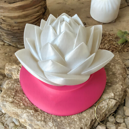 3d printed lotus flower sitting on a base that hides the LED tealight candle illuminating the flower