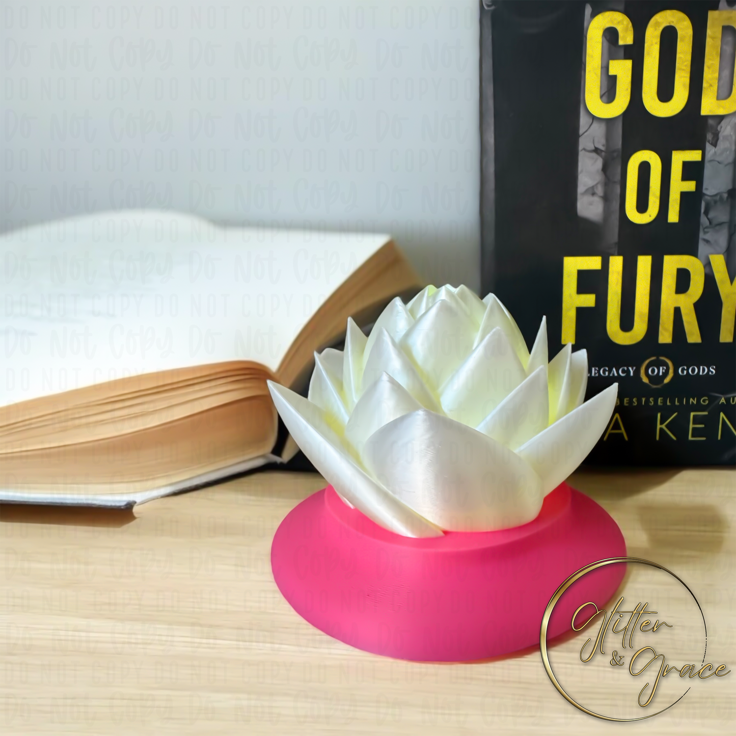 3d printed lotus flower sitting on a base that hides the LED tealight candle illuminating the flower
