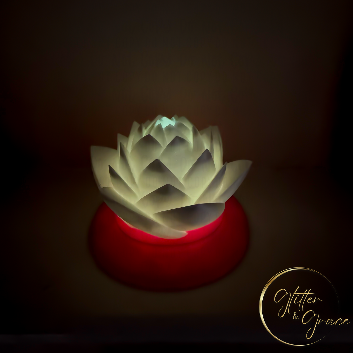 3d printed lotus flower sitting on a base that hides the LED tealight candle illuminating the flower