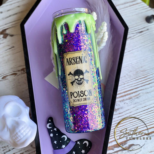 20oz skinny straight tumbler decorated with color shifting purple to green glitter topped with a green glow in the dark drip