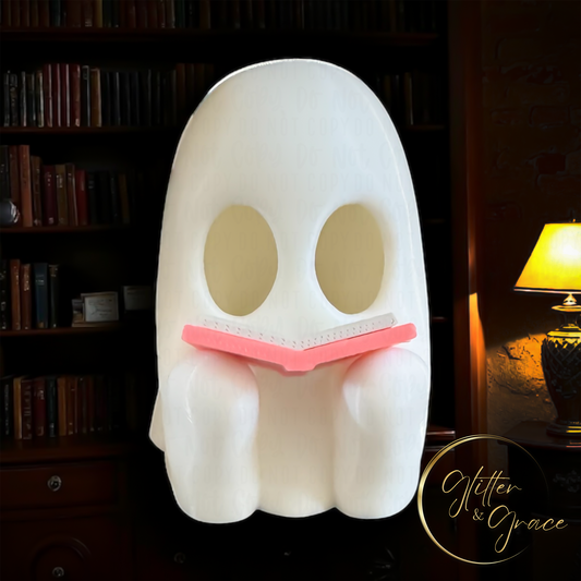 3d printed figurine of a ghost reading a book