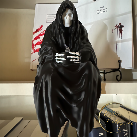 3d printed statue of a sitting grim reaper holding a led tealight candle