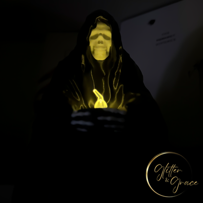3d printed statue of a sitting grim reaper holding a led tealight candle