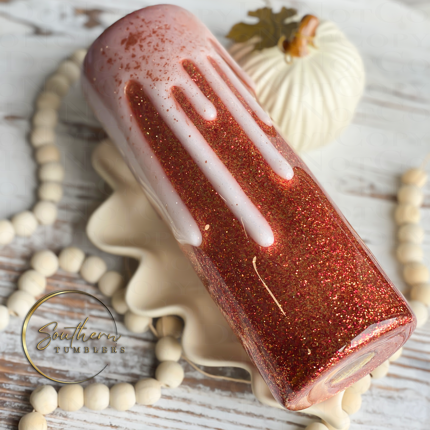 20oz skinny straight tumbler decorated with fall colored glitter, decal saying tis the season for pumpkin spice lattes and topped with a whipped cream drip effect