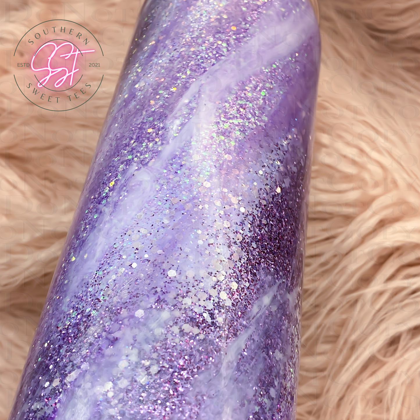 20oz tumbler decorated with shades of purple and white to represent a milky way look