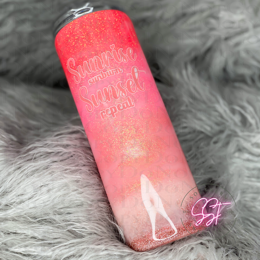20oz skinny straight tumbler designed with shades of pinks representing a sunset or sunrise on the beach saying sunrise sunburn sunset repeat